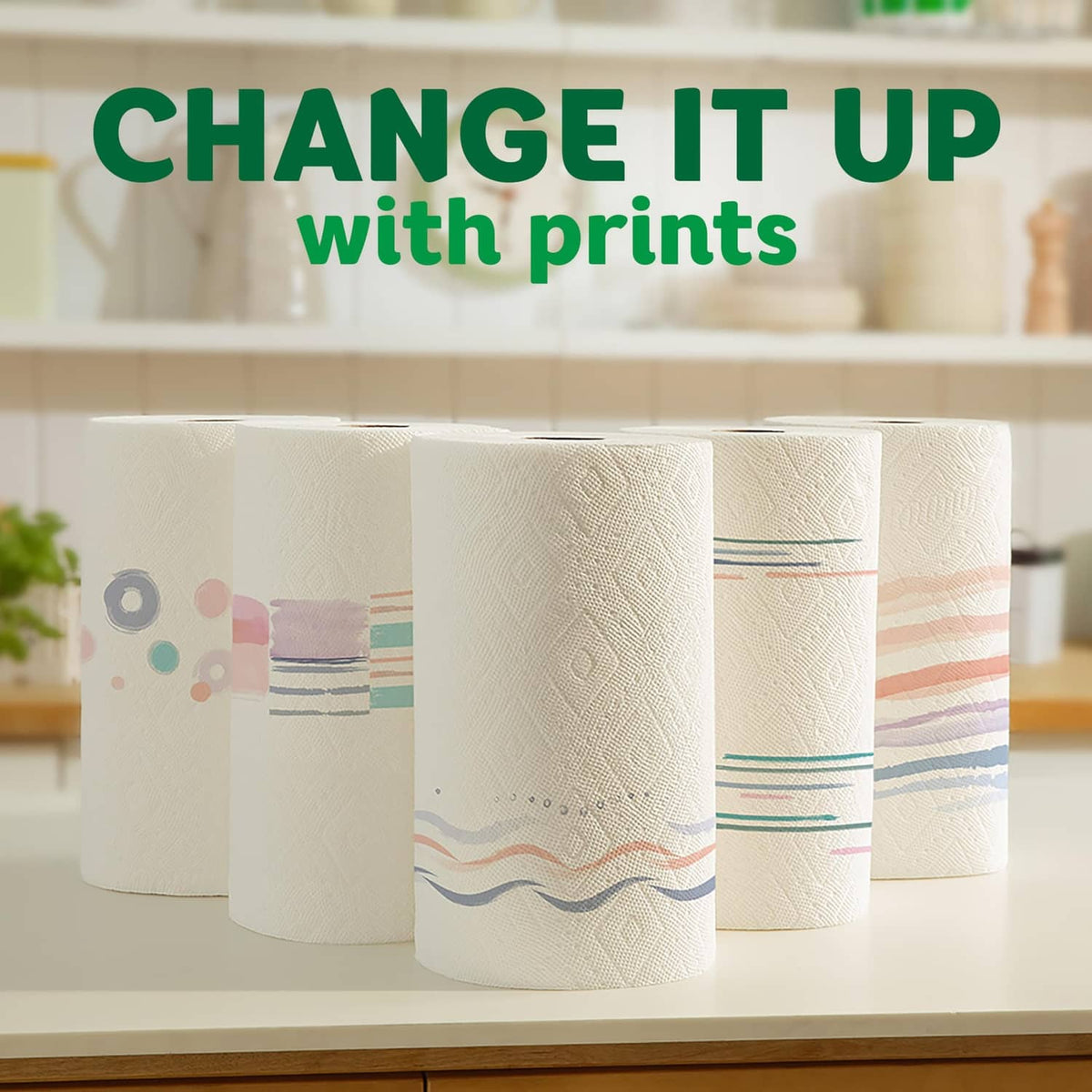 Stack of white printed paper towel rolls with colorful exterior designs