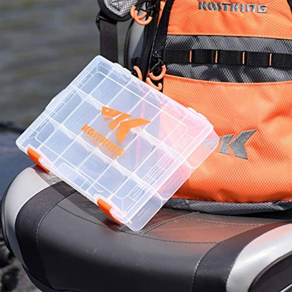 Clear plastic tackle box placed on seat near orange KASTKING gear bag