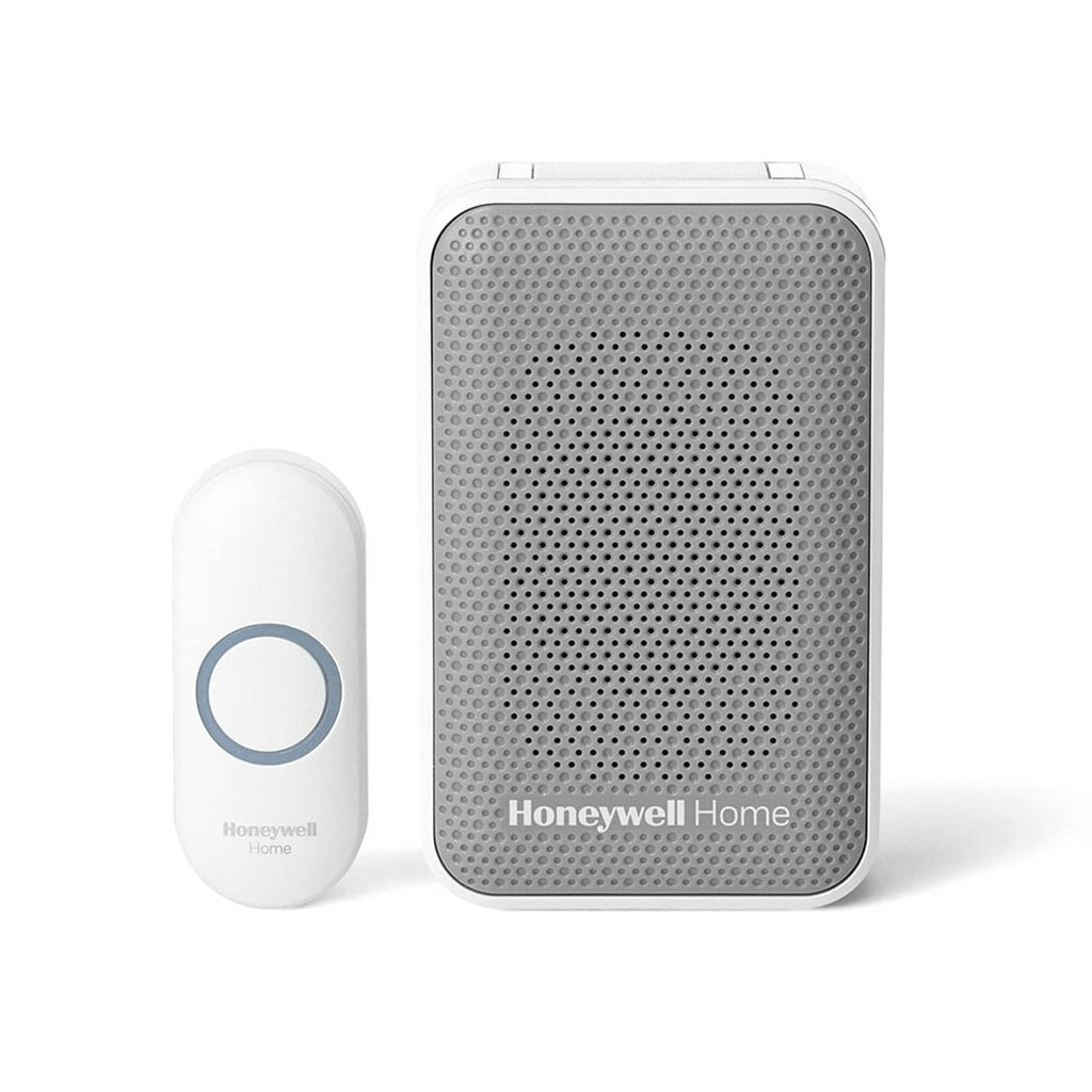 Plug-in wireless doorbell chime with mesh speaker grille and matching white button
