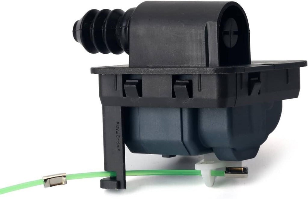 Fuel lid actuator gas door assembly, black plastic housing with green wire and mounting pins.