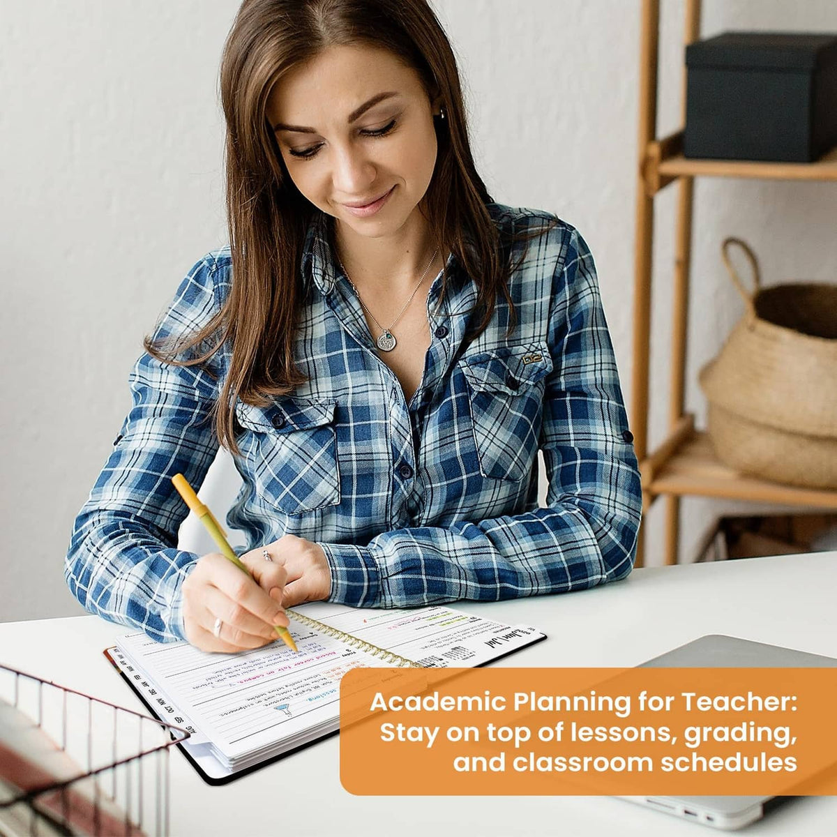 Academic planner open to a weekly schedule page with handwritten entries