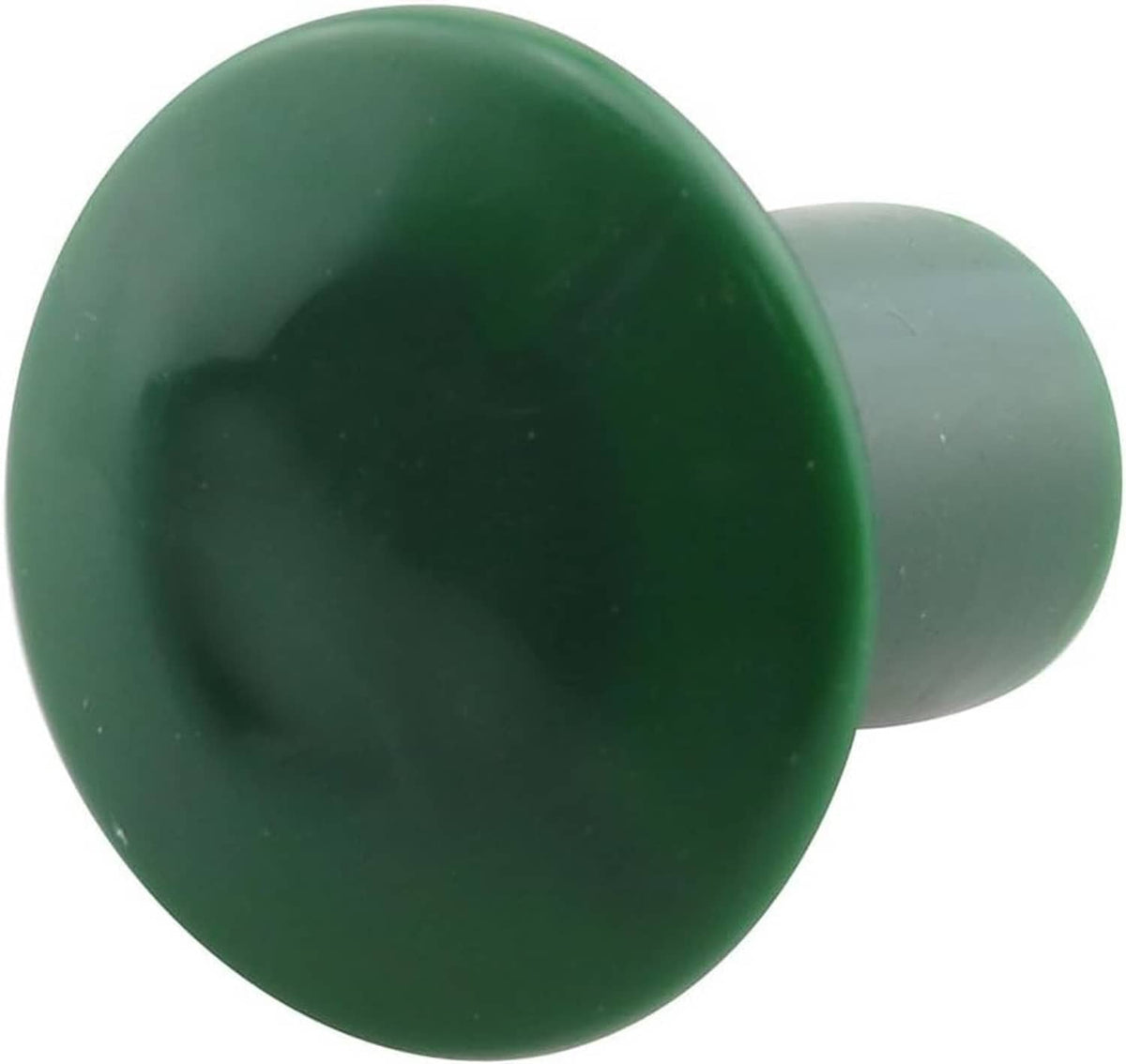 Green plastic mushroom rebar safety cap with wide round top and short stem, close-up