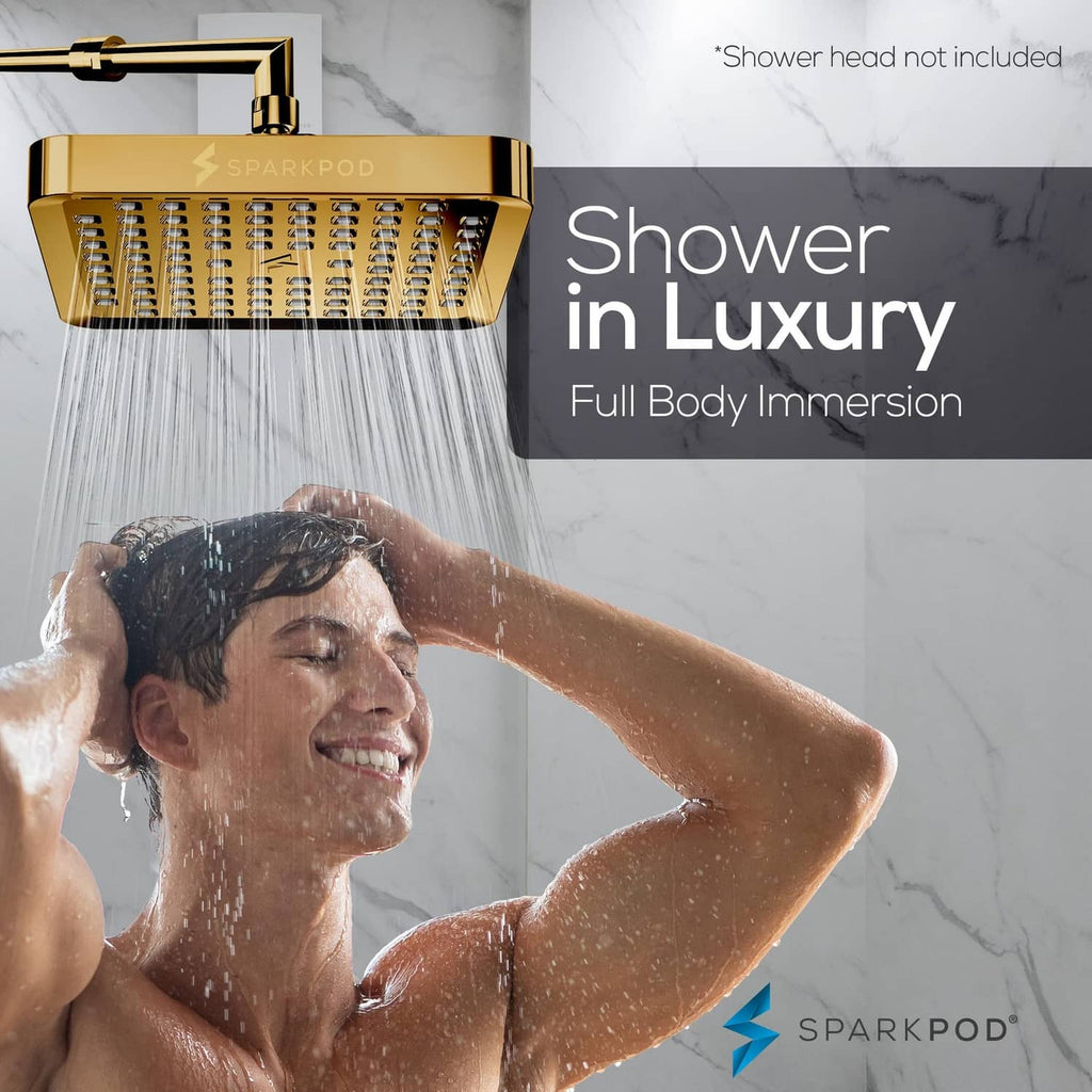Egyptian gold square rain shower head delivering full-body rain spray