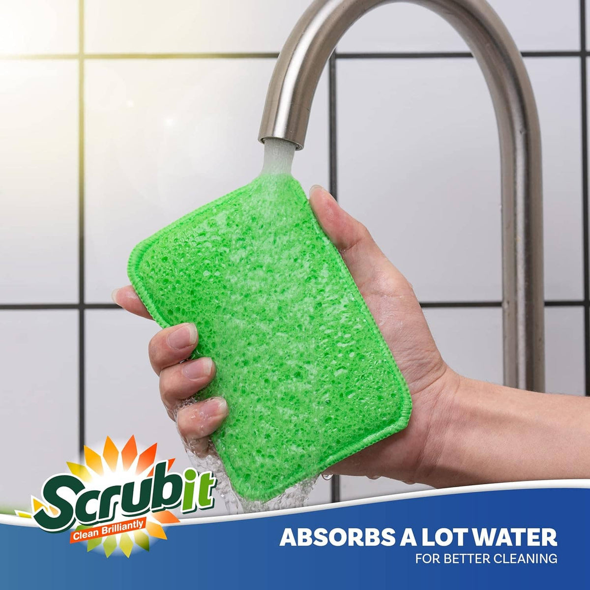 Green scrub and wipe sponge pad held near a kitchen sink faucet