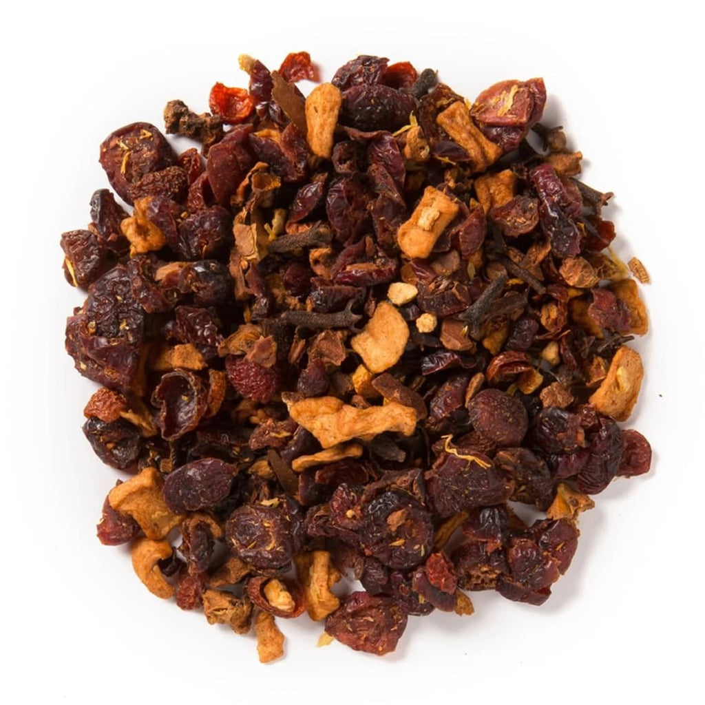 Loose leaf tea blend in bowl, dark red and orange fruit pieces