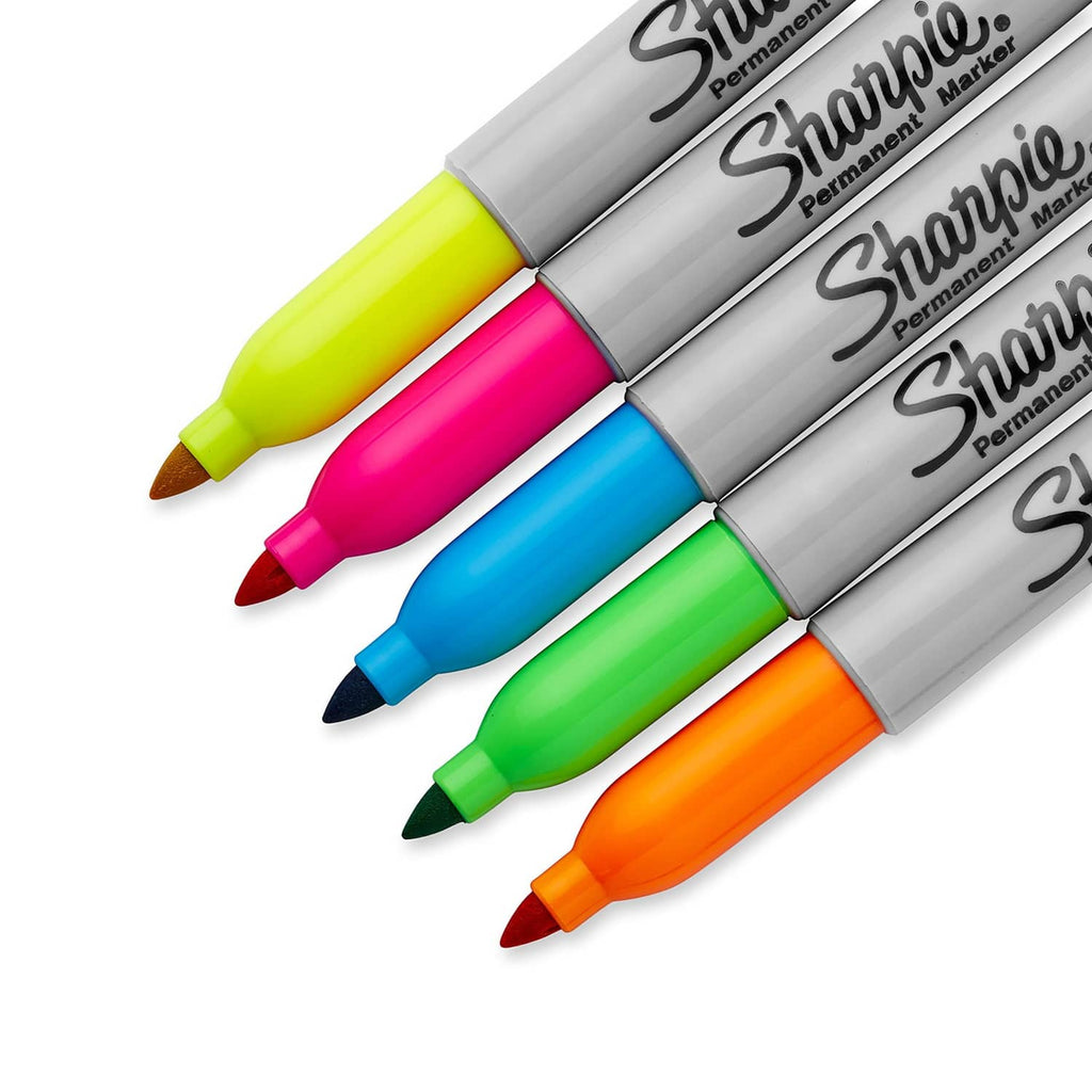 Close-up of neon permanent marker tips: yellow, pink, blue, green, orange