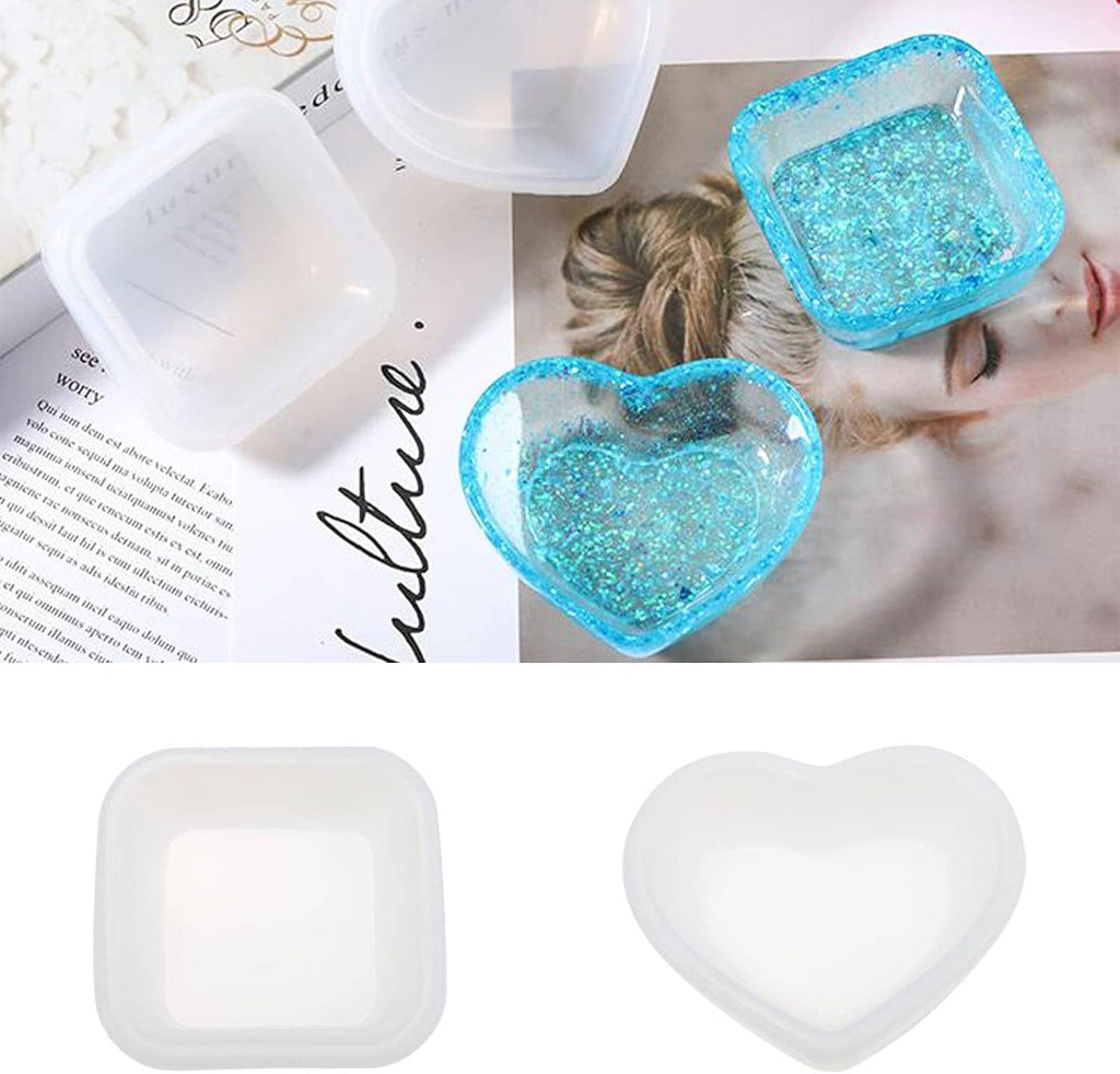 Blue glitter heart-shaped resin bowl and square tray on a craft surface