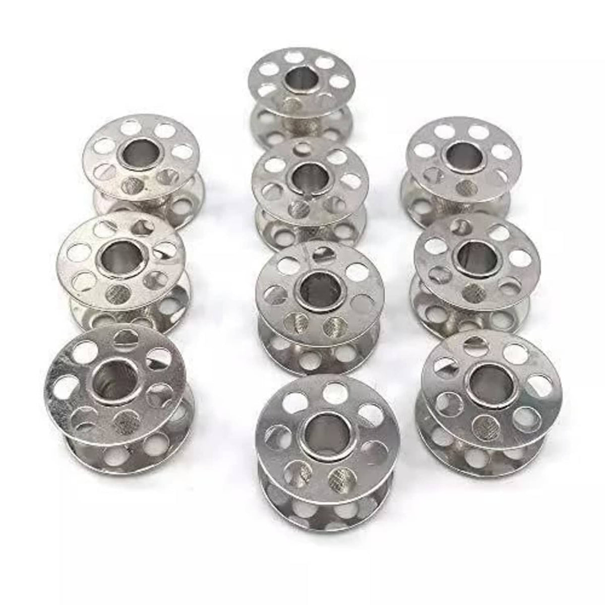 Assorted silver metal sewing bobbins, round reels with center hole and thread passages