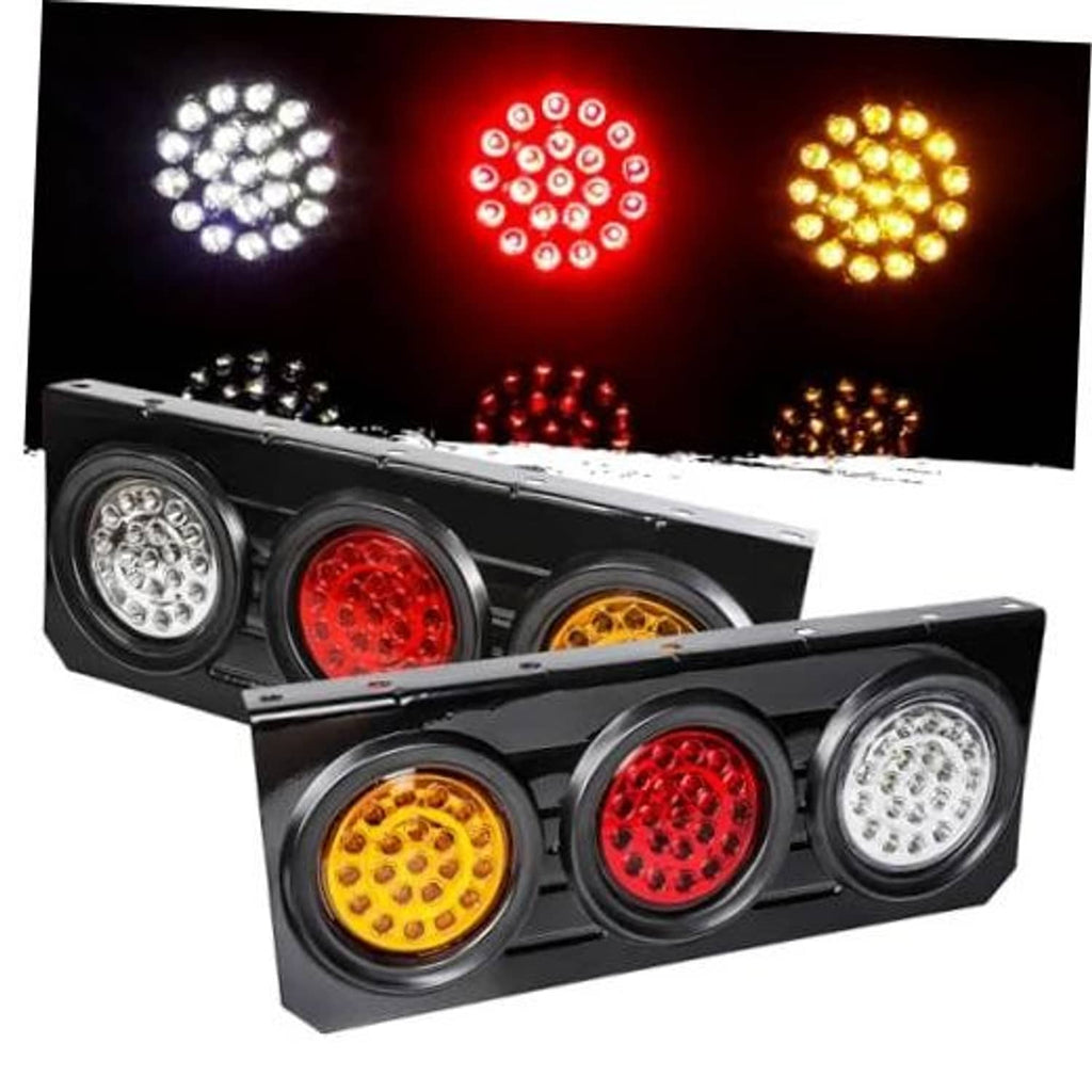 Truck trailer LED tail light bar with round lenses showing white, red, and amber LEDs