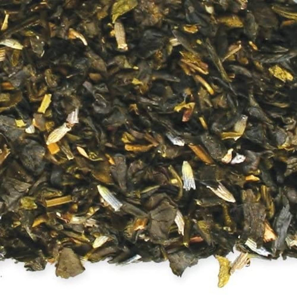 Close-up of organic earl grey green loose-leaf tea leaves with small pale bits