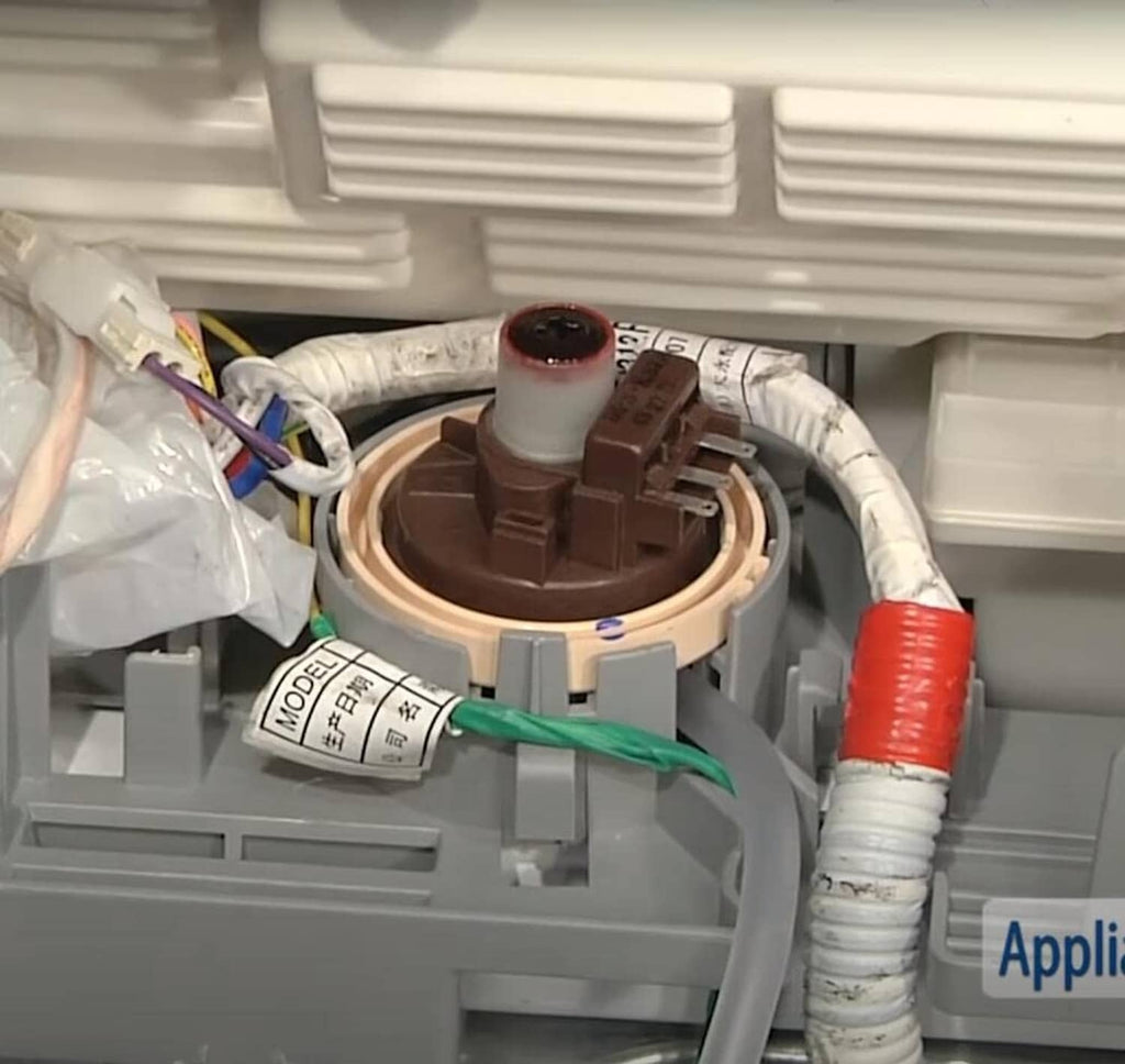Washer water level pressure sensor switch installed inside washer, showing wiring and hose