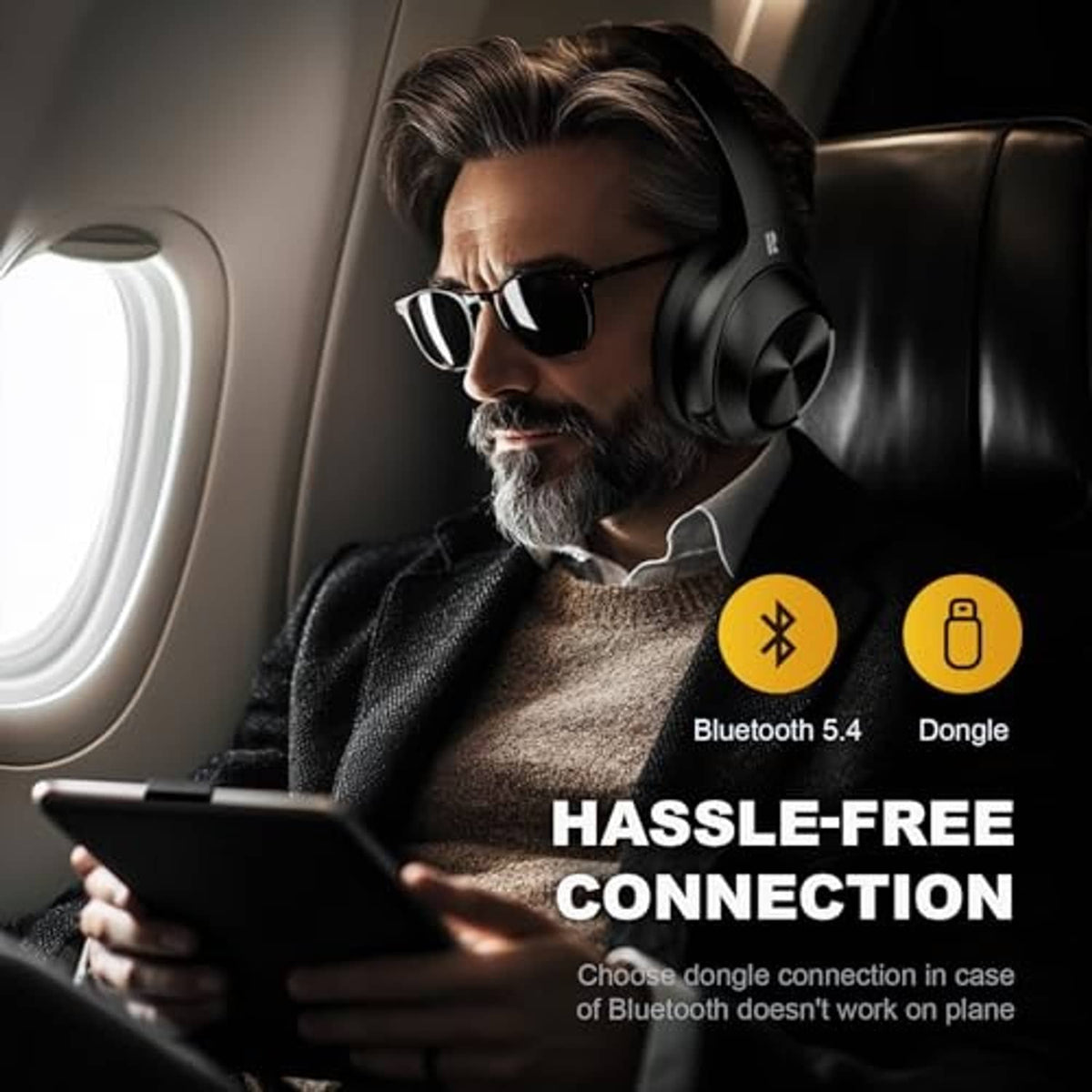 Matte black over-ear headphones with cushioned earcups and headband, side view