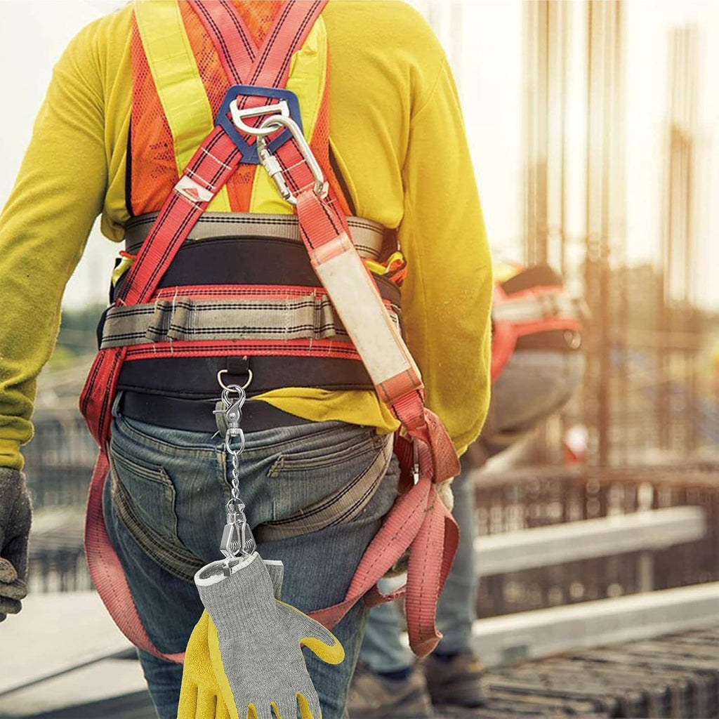 Metal glove clip with chain attached to work pants near a safety harness