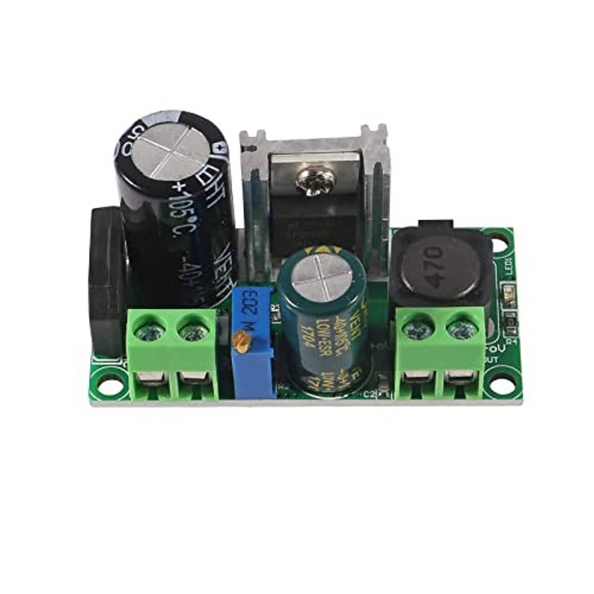 Close-up of step-down buck converter board with screw terminals and black electrolytic caps