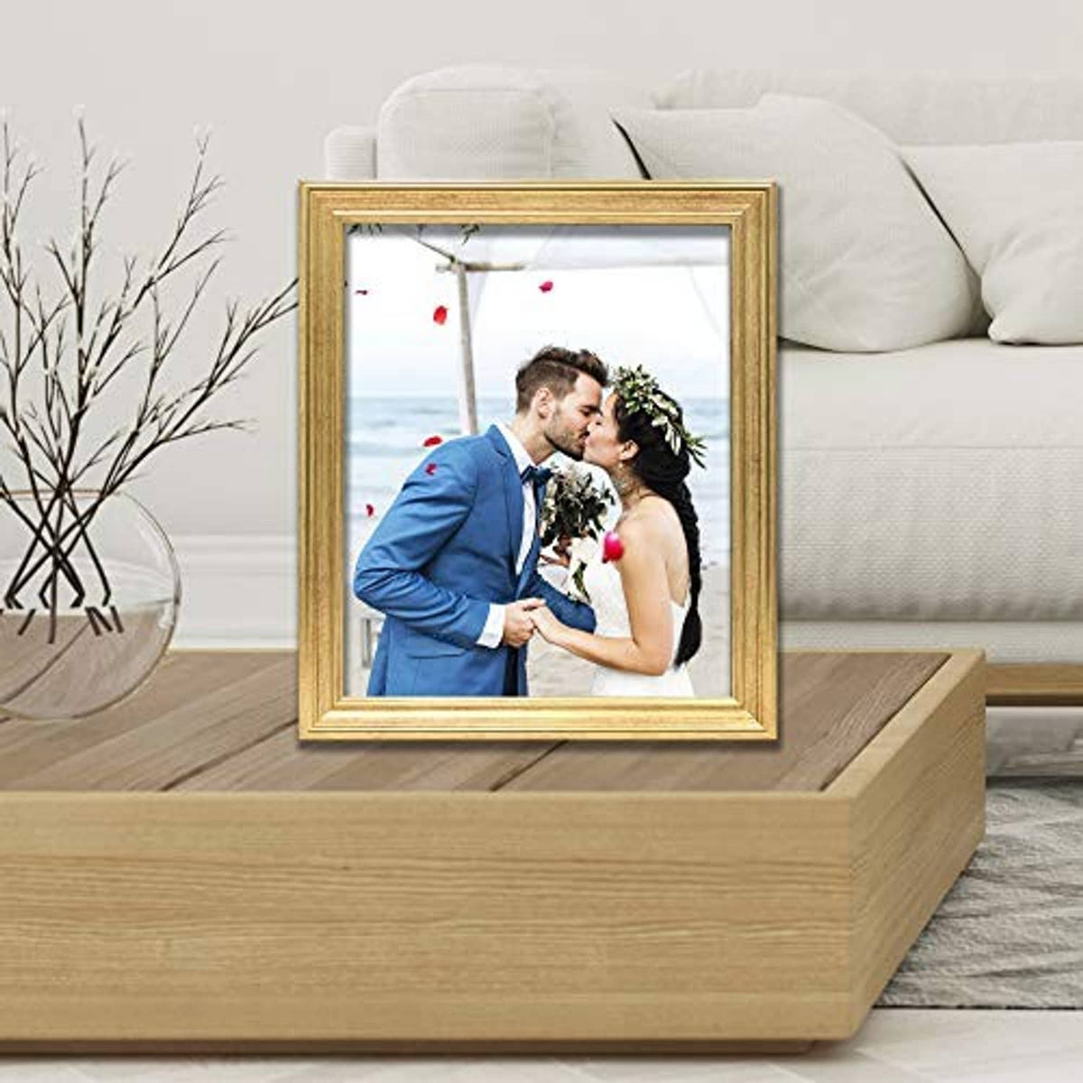 Gold 8x10 picture frame holding a wedding portrait photo, front view