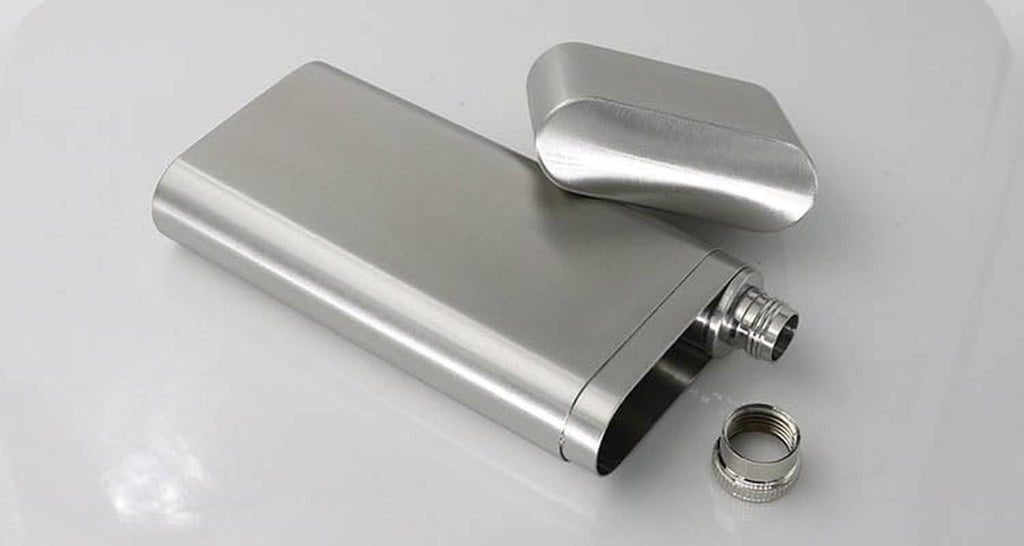 Stainless steel cigar case with open end, flask tube and screw cap in view