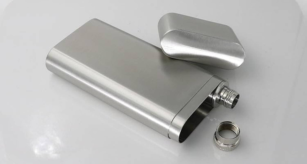 Stainless steel cigar case with open end, flask tube and screw cap in view