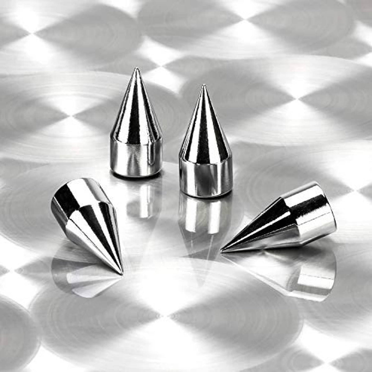 Four silver chrome spiked valve caps with glossy pointed cone shapes