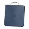 Dark blue hard CD/DVD case with carry handle and front emblem, closed.