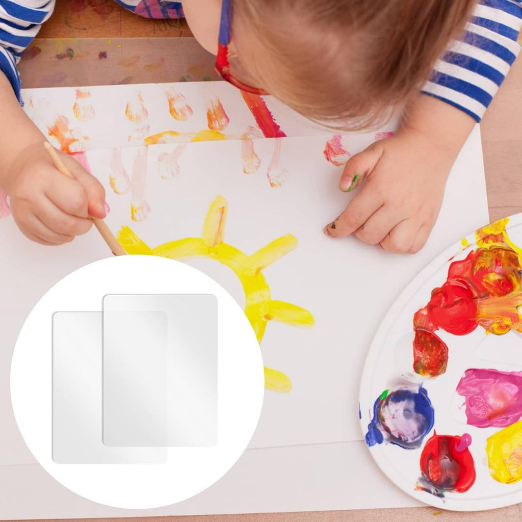 Clear matte plastic placemat used as a kids craft and painting surface