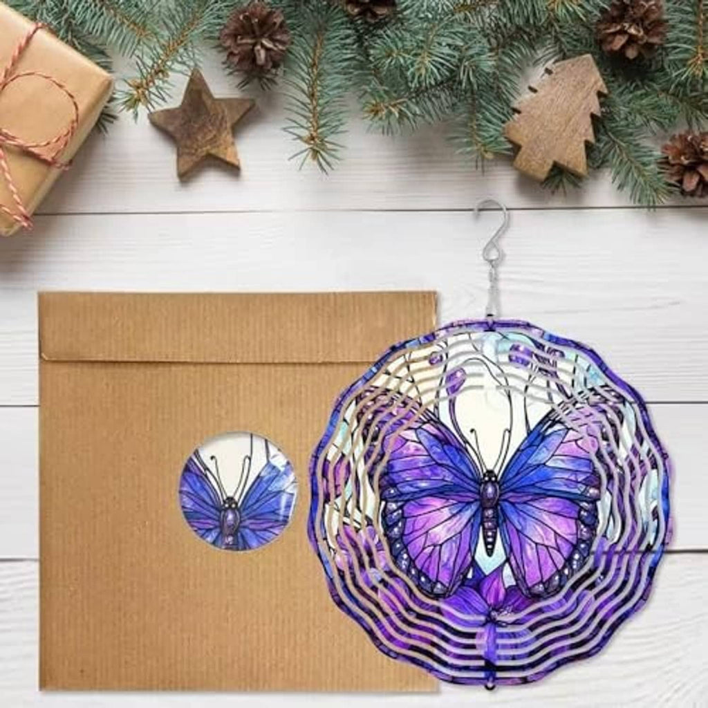 Purple butterfly wind spinner with white spiral rings hanging from a top hook