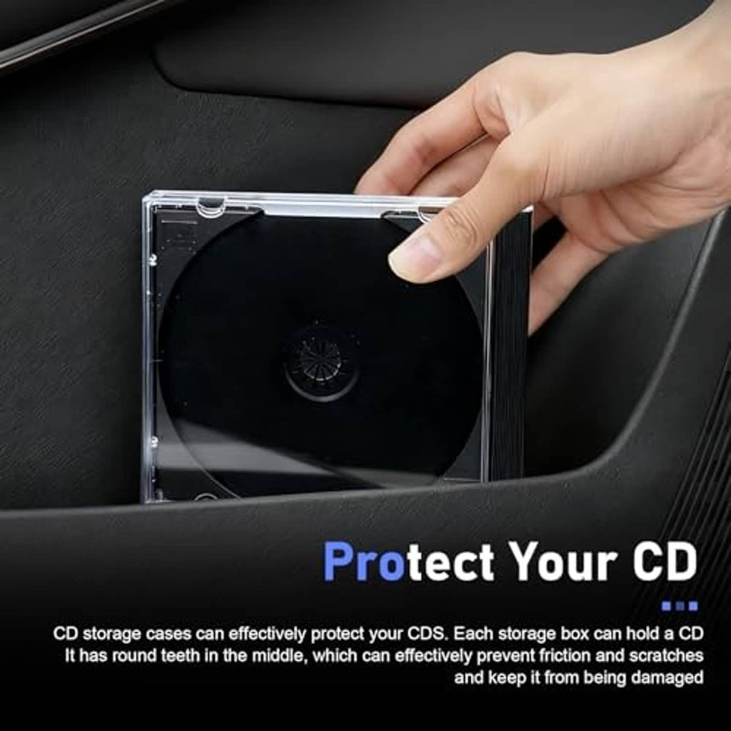 Hand holding a clear CD jewel case with dark disc against a surface