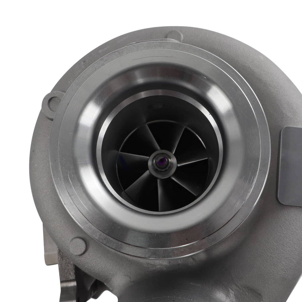 Diesel turbocharger front view with circular compressor housing and black impeller