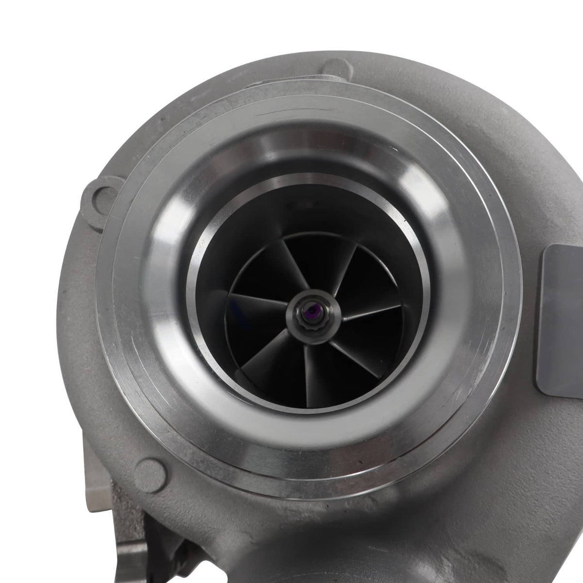 Diesel turbocharger front view with circular compressor housing and black impeller