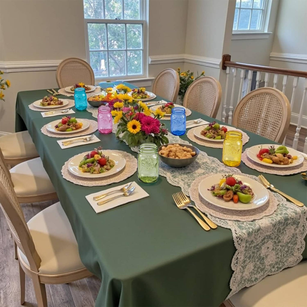 Colorful wide-mouth mason jars with metal lids on a dining table for an occasion.