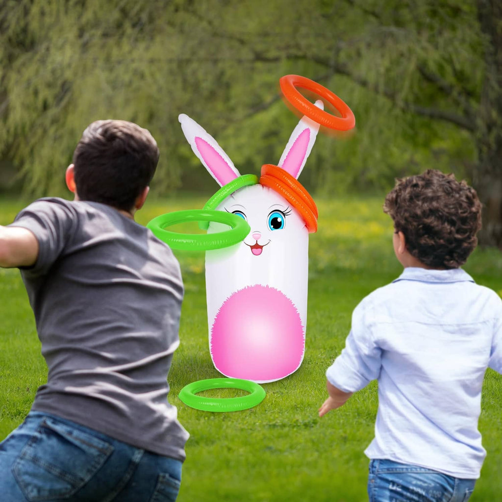 Inflatable bunny yard game with rings as children stand ready to toss