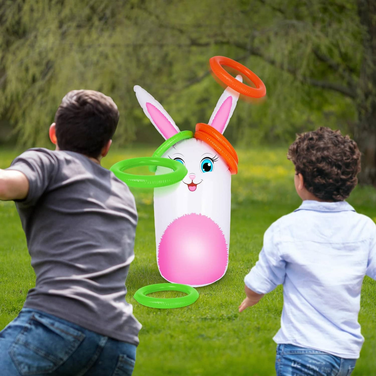 Inflatable bunny yard game with rings as children stand ready to toss