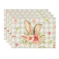 Four-pack of rectangular beige plaid bunny-ear floral placemats.