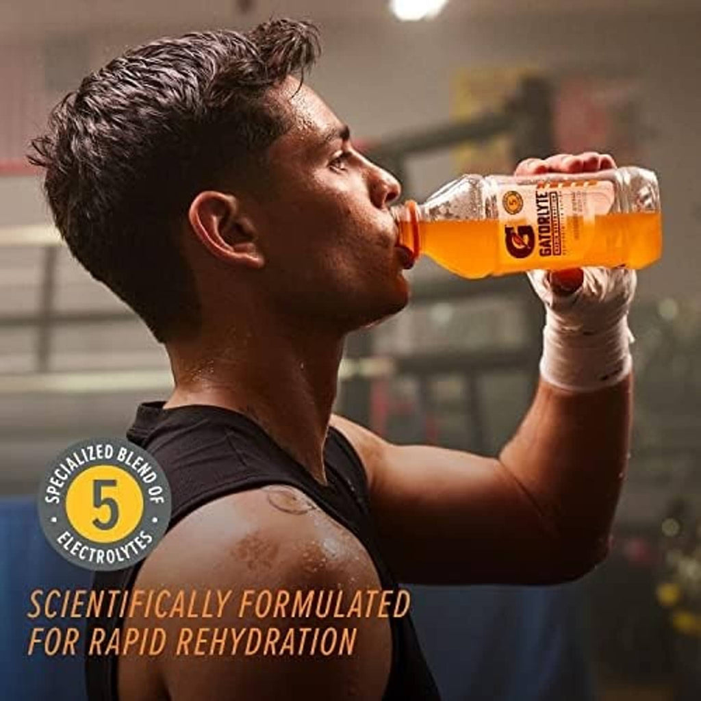 Gatorlyte Cherry Lime electrolyte drink bottle being sipped, orange cap