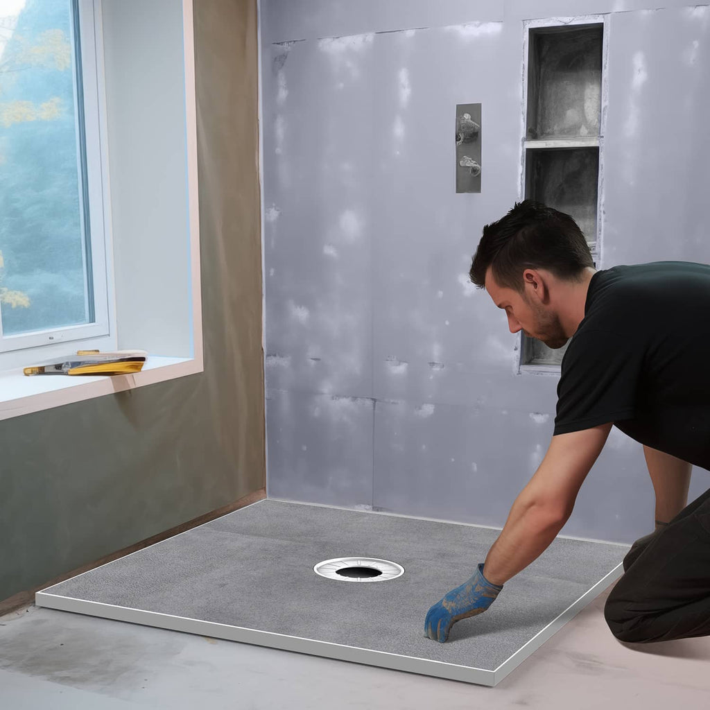 Gray shower curb tray kit with central drain opening installed in room
