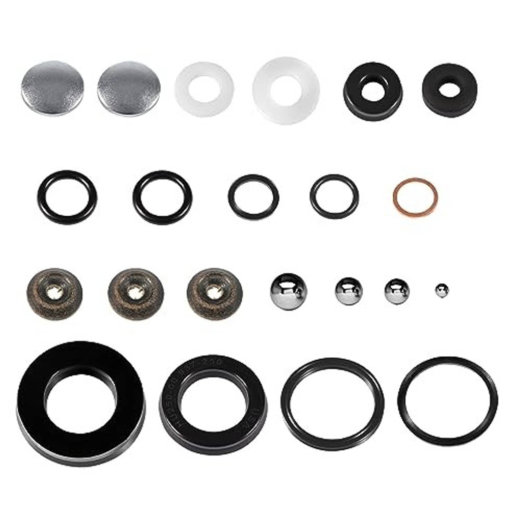Floor jack seal kit with black and white spacers, metal plugs, and small O-rings