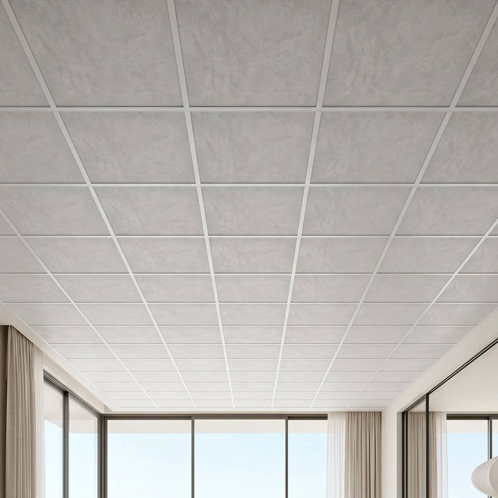 Close-up of white marble-look ceiling tiles in a grid with window light in view