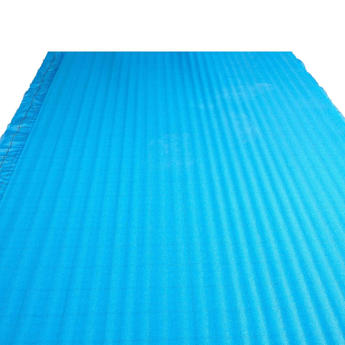 Blue floor underlayment vapor barrier sheet with subtle ribbed texture and grid lines