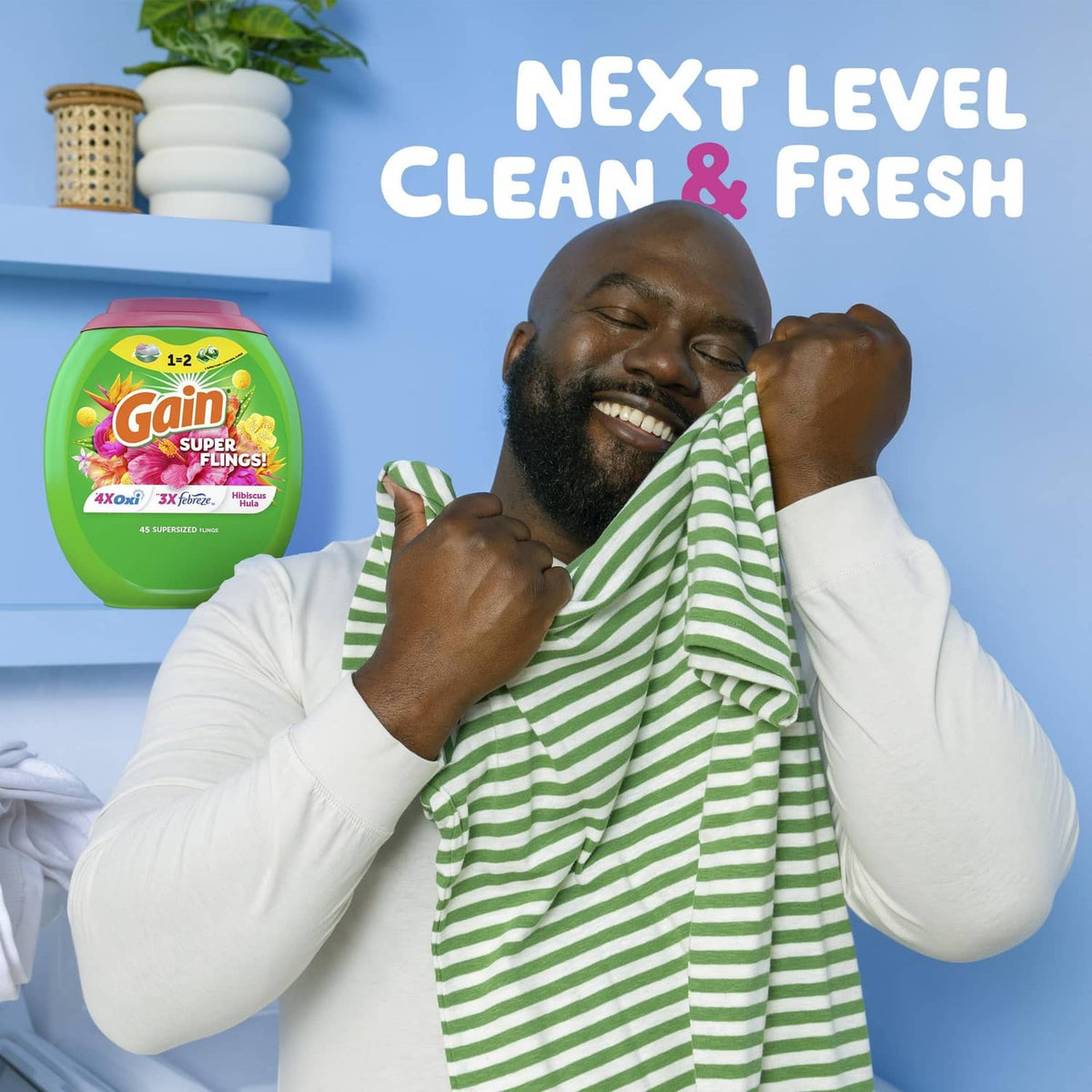 Gain detergent bottle with Next Level Clean & Fresh branding