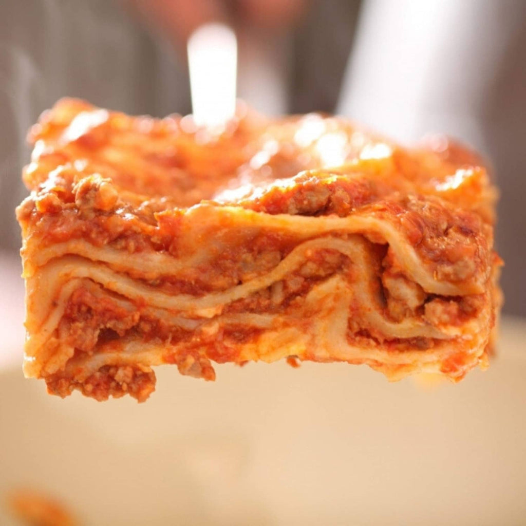 Gluten-free lasagna slice with baked layers and melted cheese