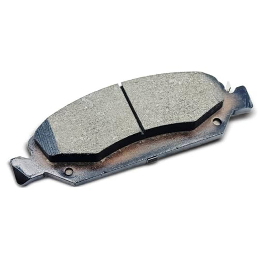 Ceramic brake pad with gray friction surface and rust-toned metal backing