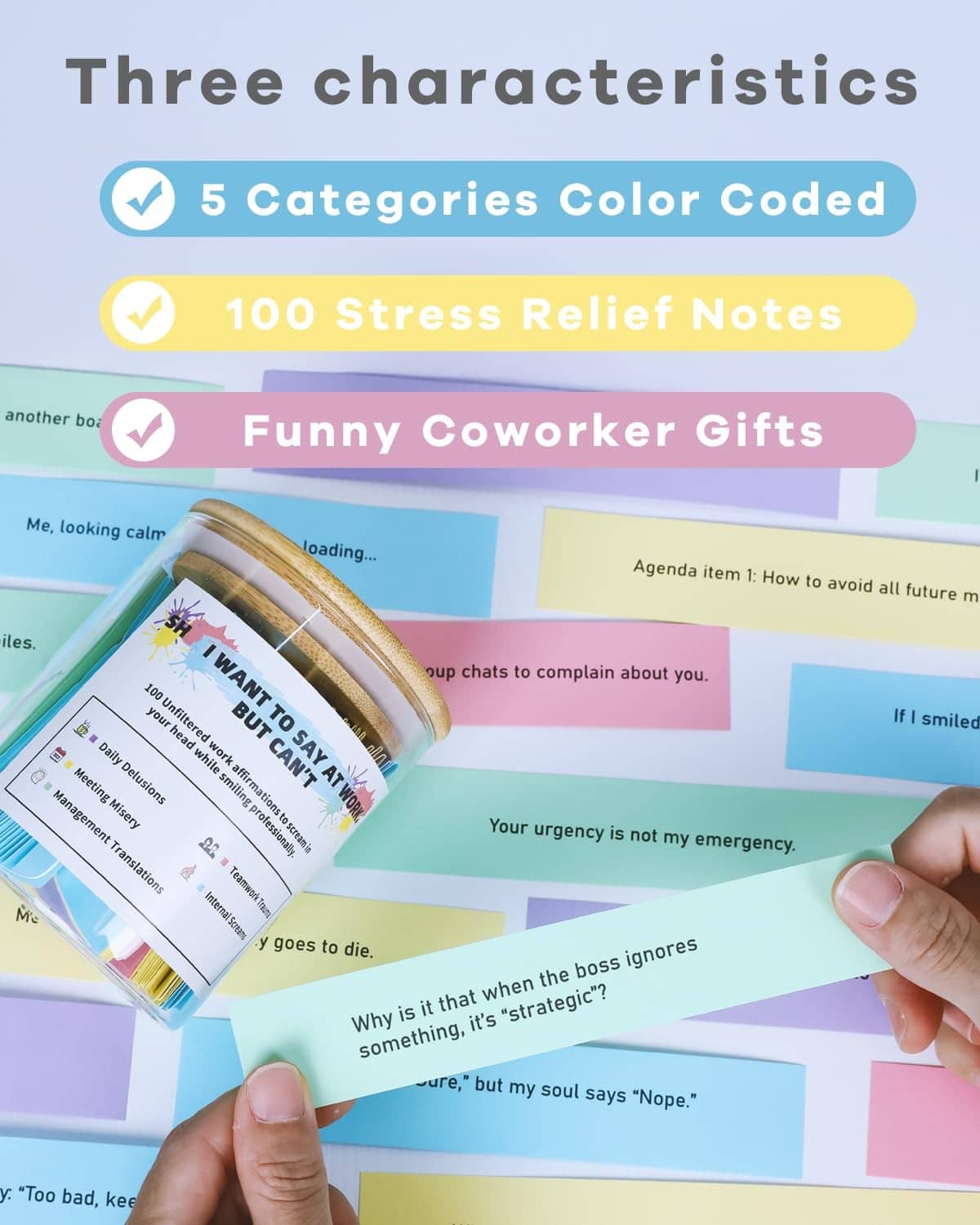 Color-coded work affirmation notes fanned beside a glass jar with wood lid