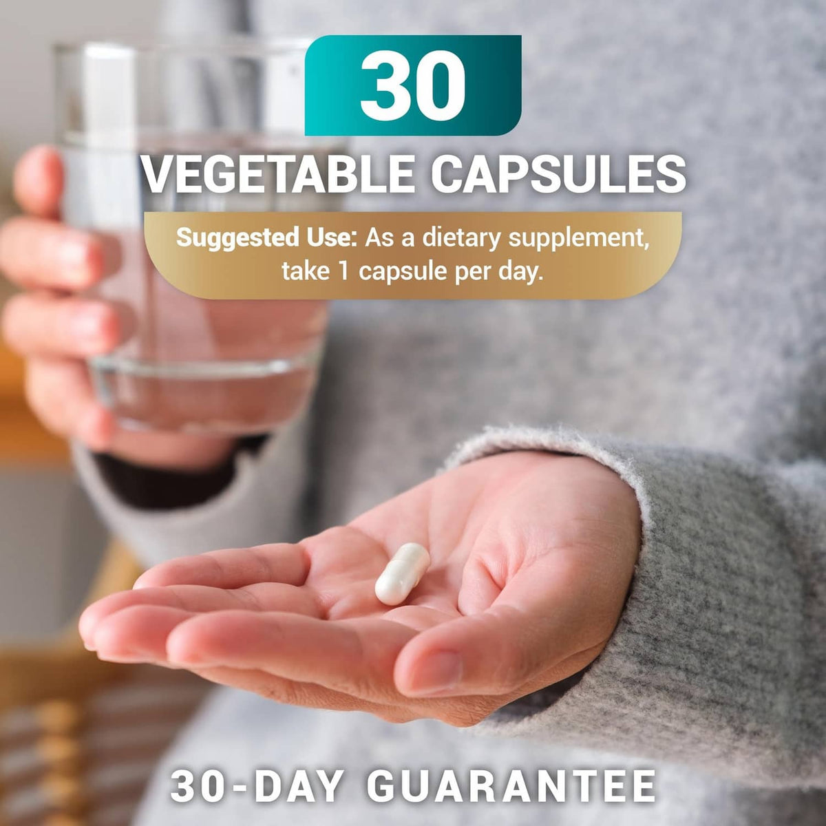 Vegetable supplement capsules in hand, 30-day count