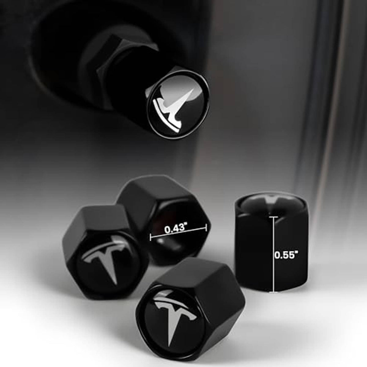 Black hex tire valve stem caps with Tesla logo, shown with height and width