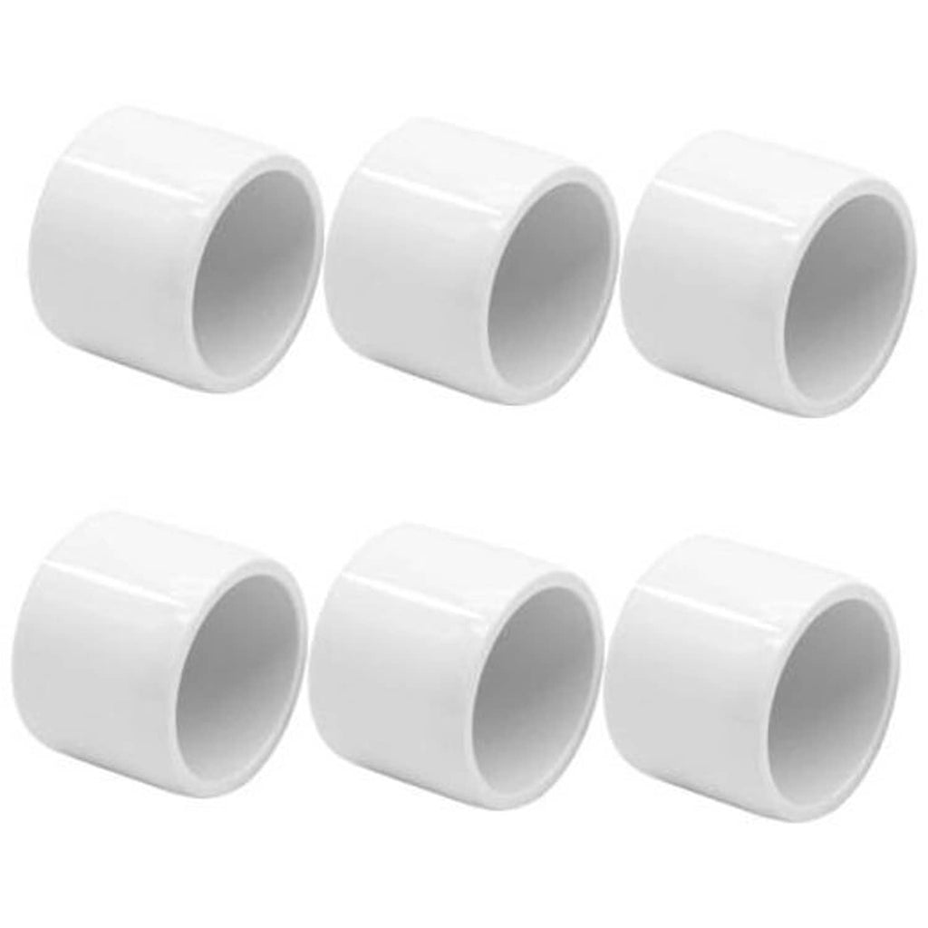 Set of white PVC pipe end caps, 1-1/4 in, smooth cylindrical plug fittings