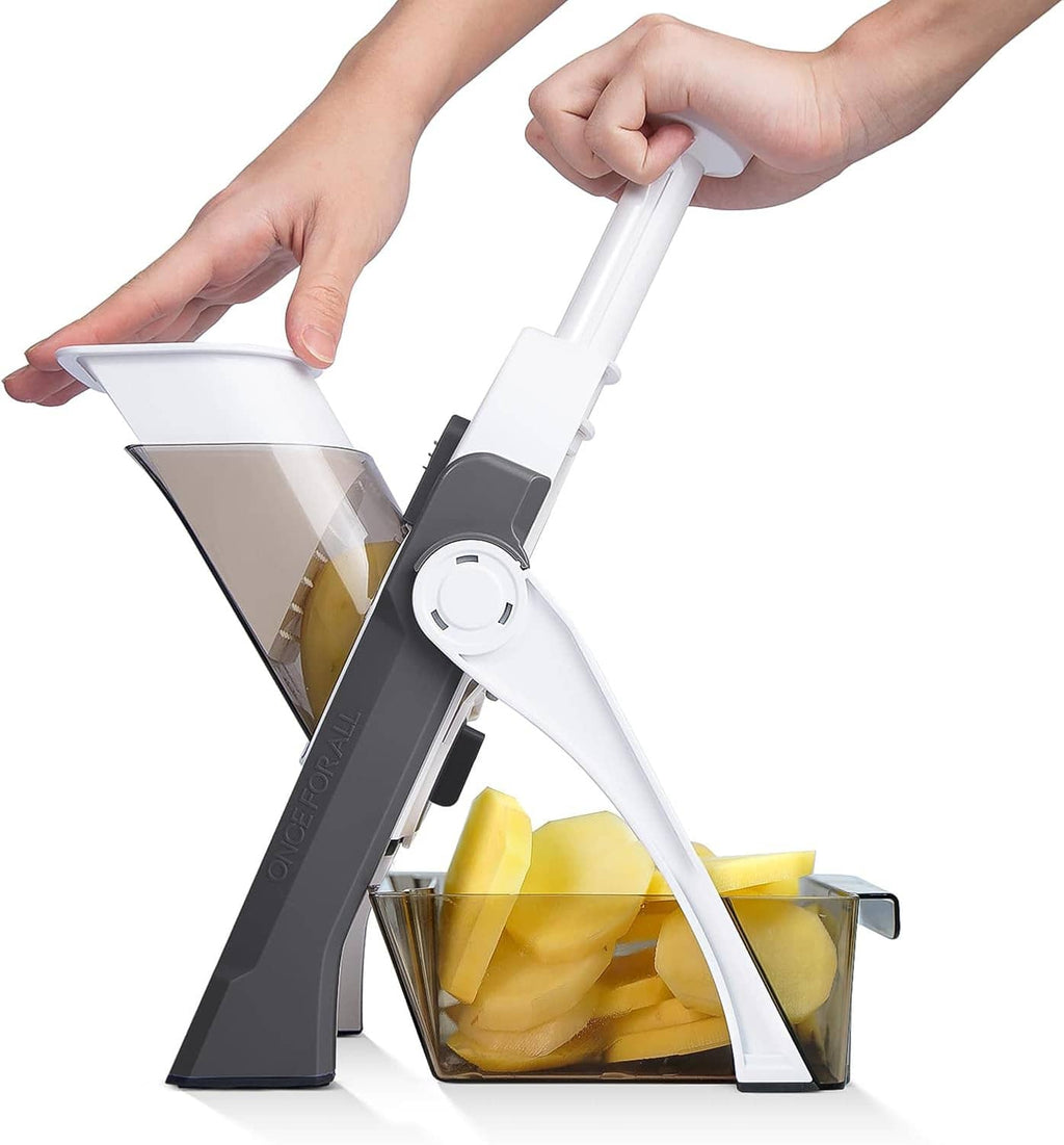 Adjustable mandoline slicer with white handle, dark cutting frame, and food basket