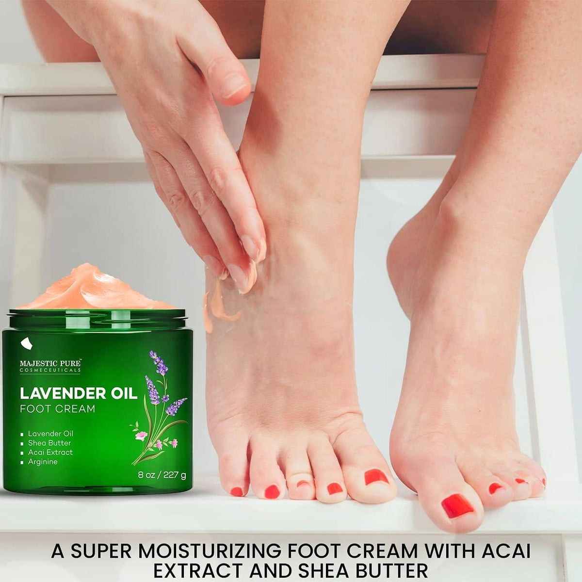 Majestic Pure lavender oil foot cream; hand applying to feet, green 8 oz jar.
