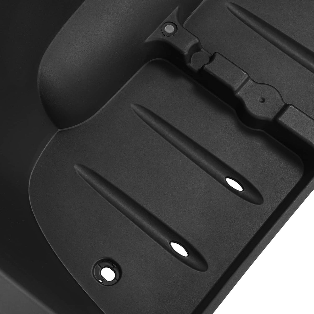 Close-up of black rear bagwell liner with ridged channels and mounting details
