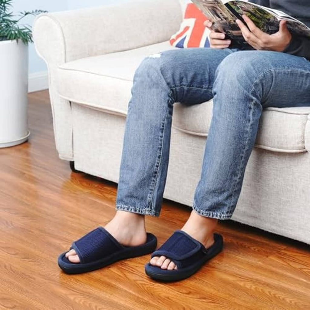 Navy open-toe slippers worn with jeans, hook-and-loop wrap strap