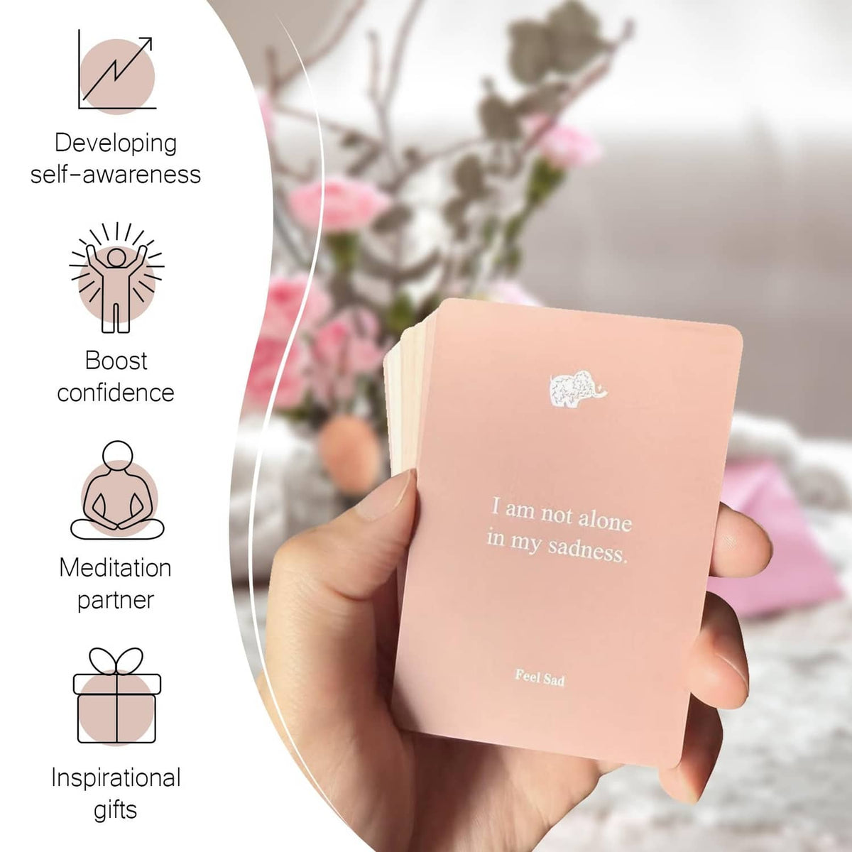 Pink affirmation card in hand with “I am not alone” and calming icons
