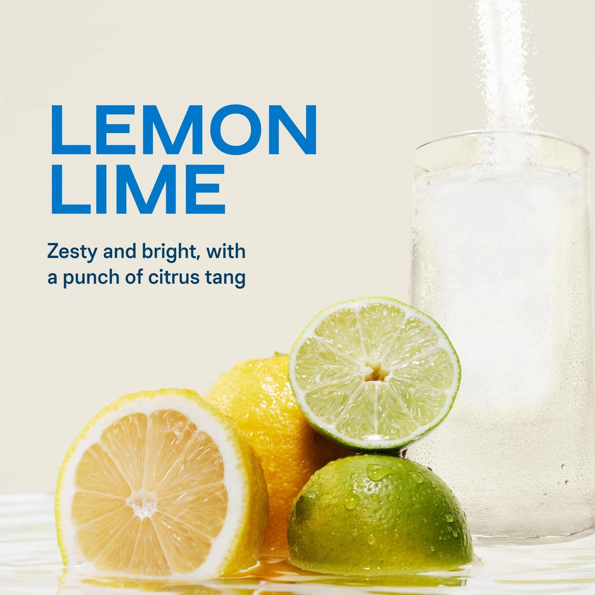 Lemon lime electrolyte drink mix with lime and lemon slices beside a glass